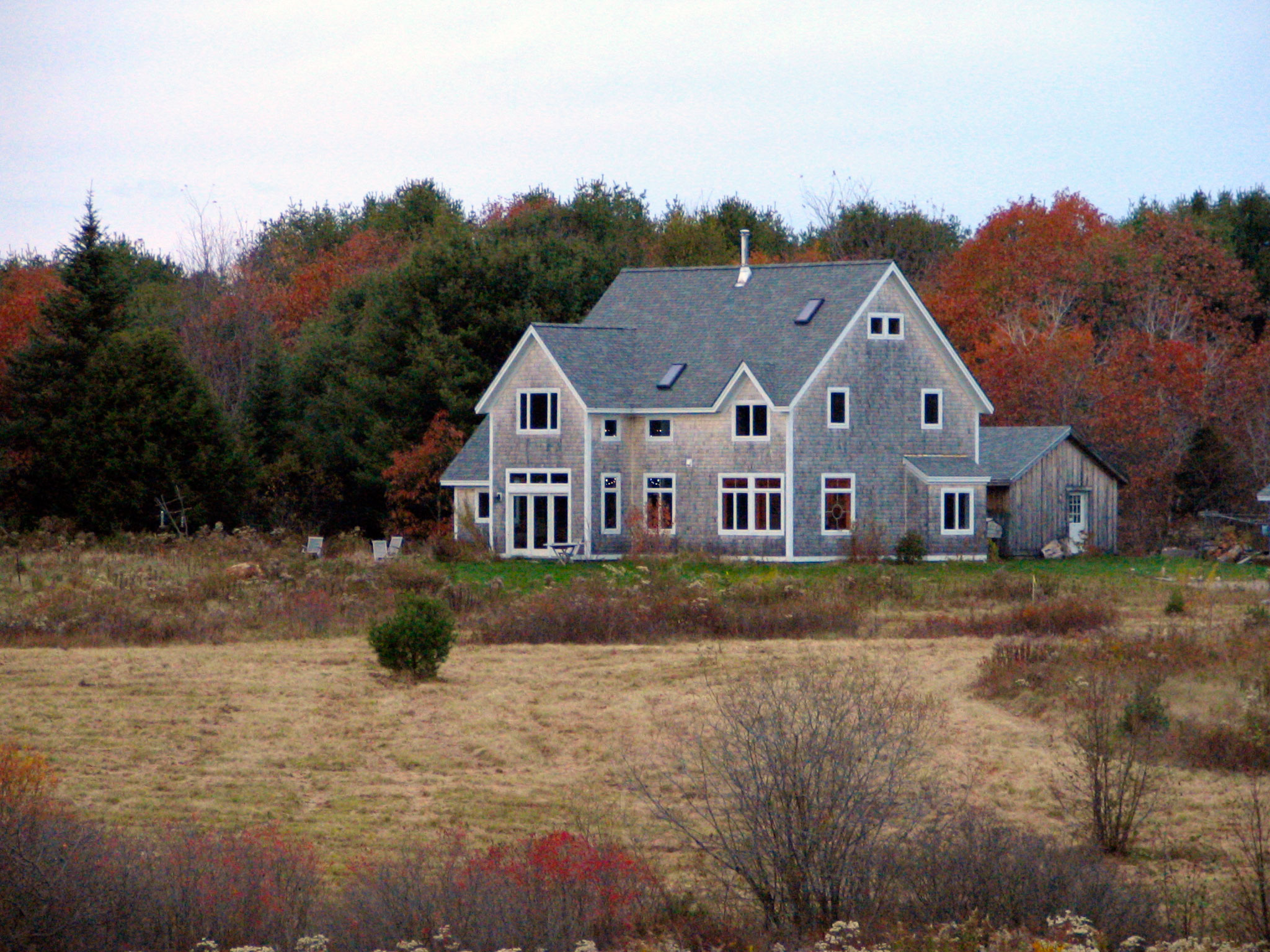 A house in a field in Brunswick, Maine